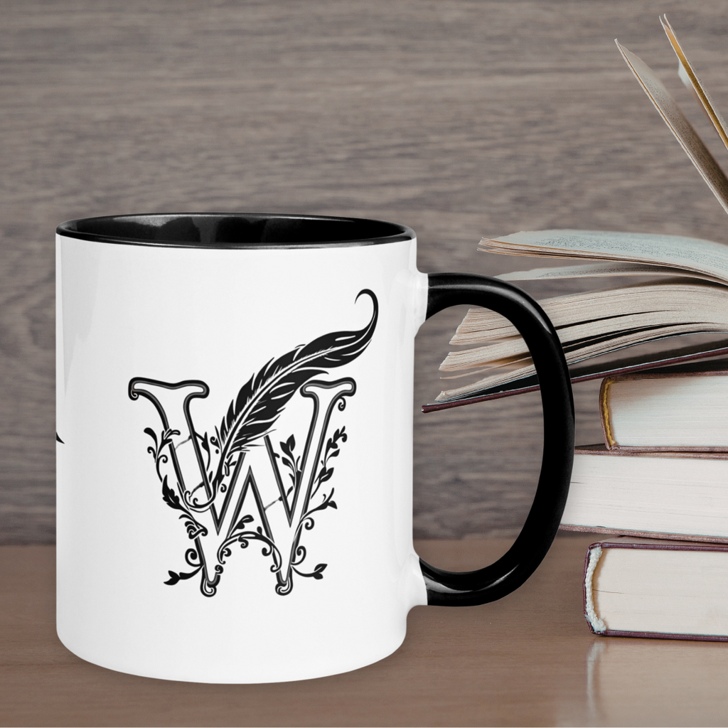  Signature Wordwhispers accent mug — white 11oz ceramic with black interior, rim, and handle, featuring the elegant "W" quill logo