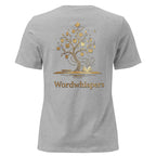 Back view of women’s relaxed-fit T-shirt featuring a gold tree with books among its branches, stars, a crescent moon, and Wordwhispers lettering beneath in athletic heather