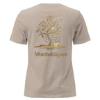 Back view of women’s relaxed-fit T-shirt featuring a gold tree with books among its branches, stars, a crescent moon, and Wordwhispers lettering beneath in stone